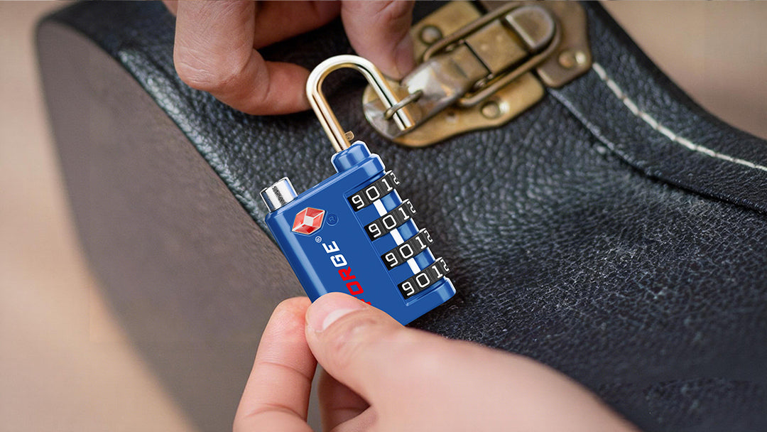 Hands attaching a TSA combination lock to a suitcase latch for secure travel.