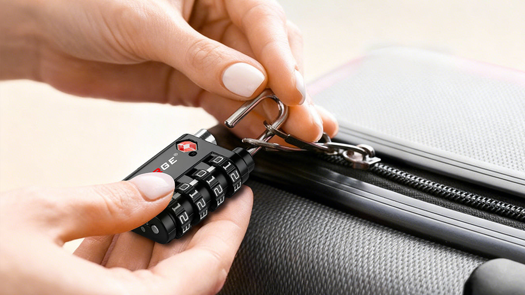 A person securing a TSA-approved combination lock on a suitcase zipper.